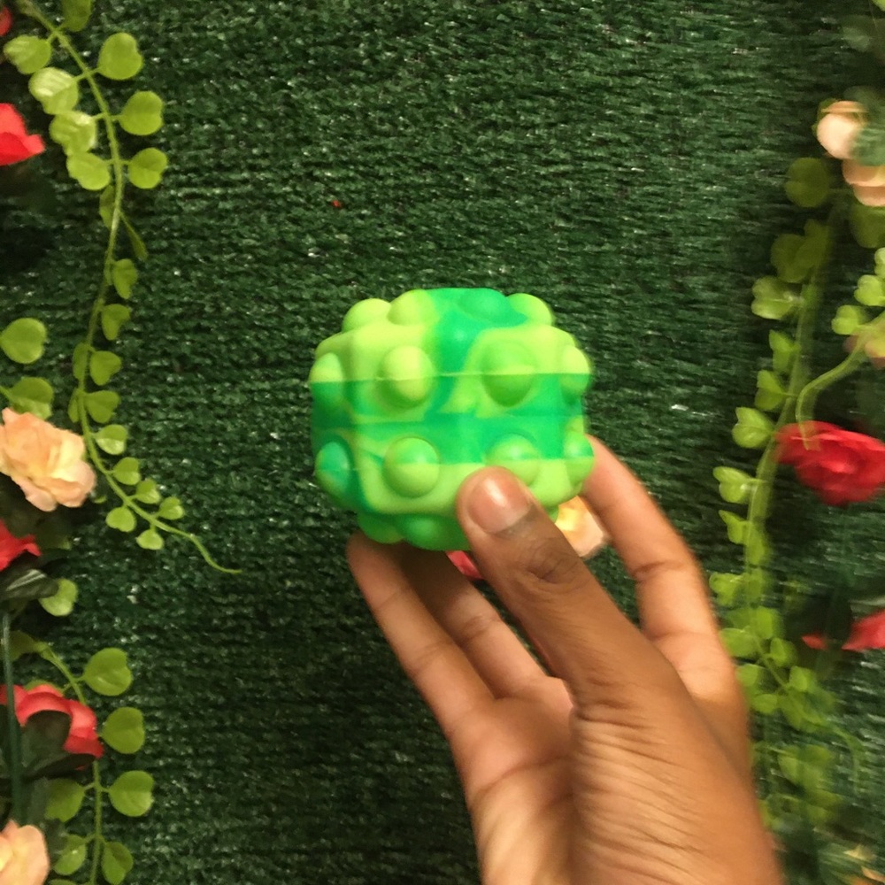 Green pop it ball.